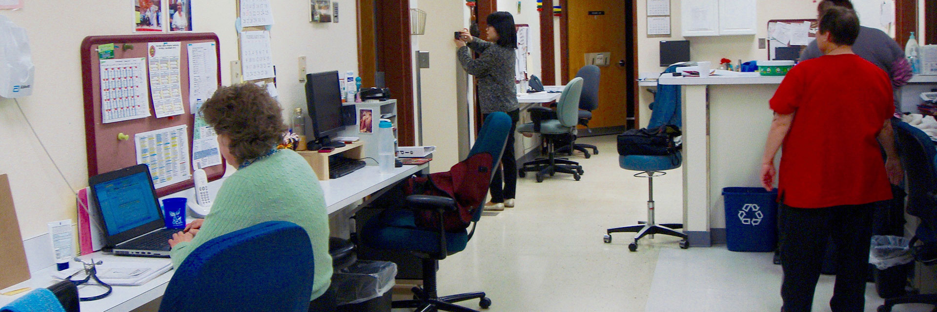 A researcher works in a medical office setting.